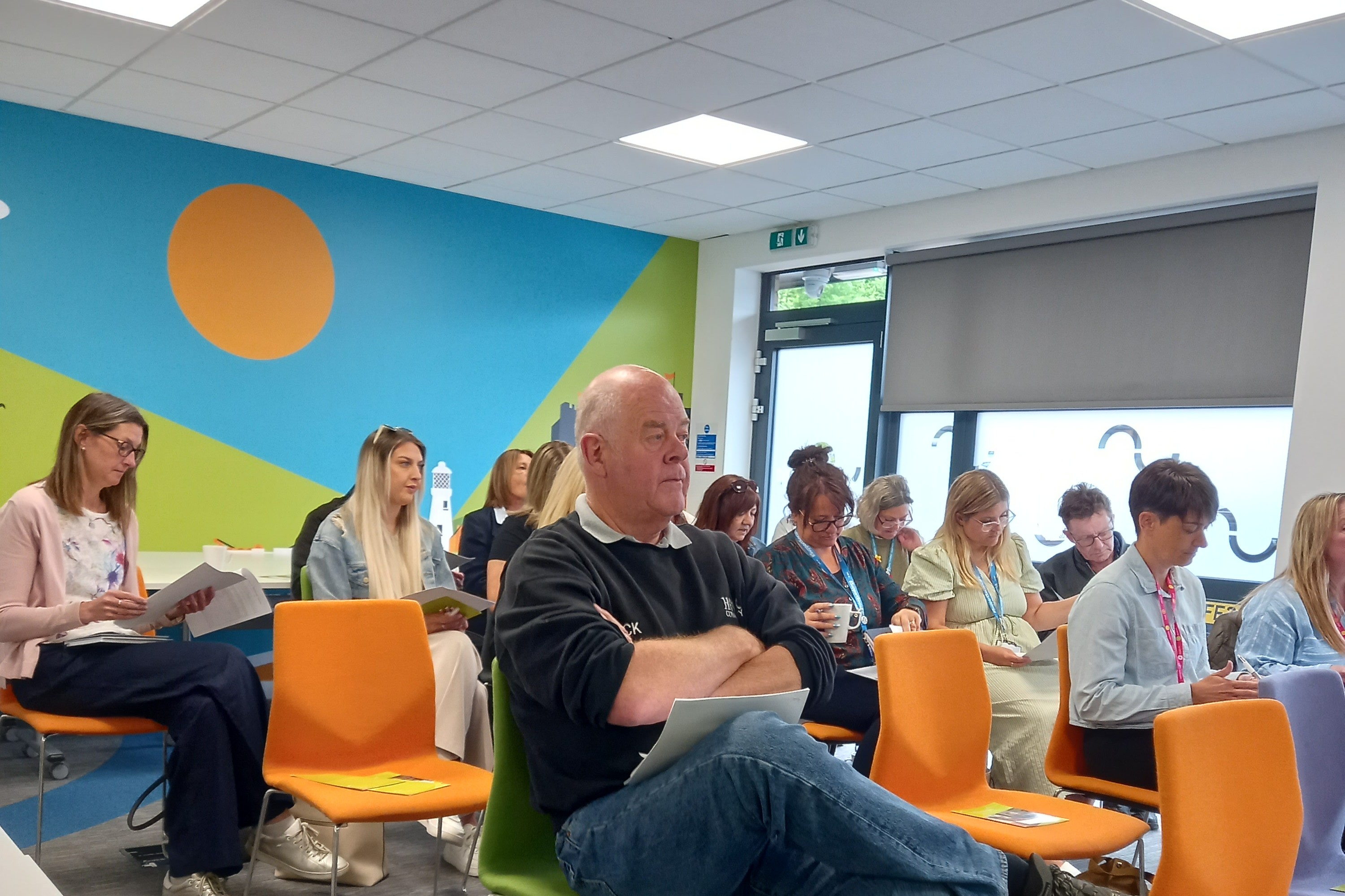 Attendees including health and social care professionals, housing specialists and community partners at Newtide Homes' Housing with Care networking event during a presentation by one of the day's speakers