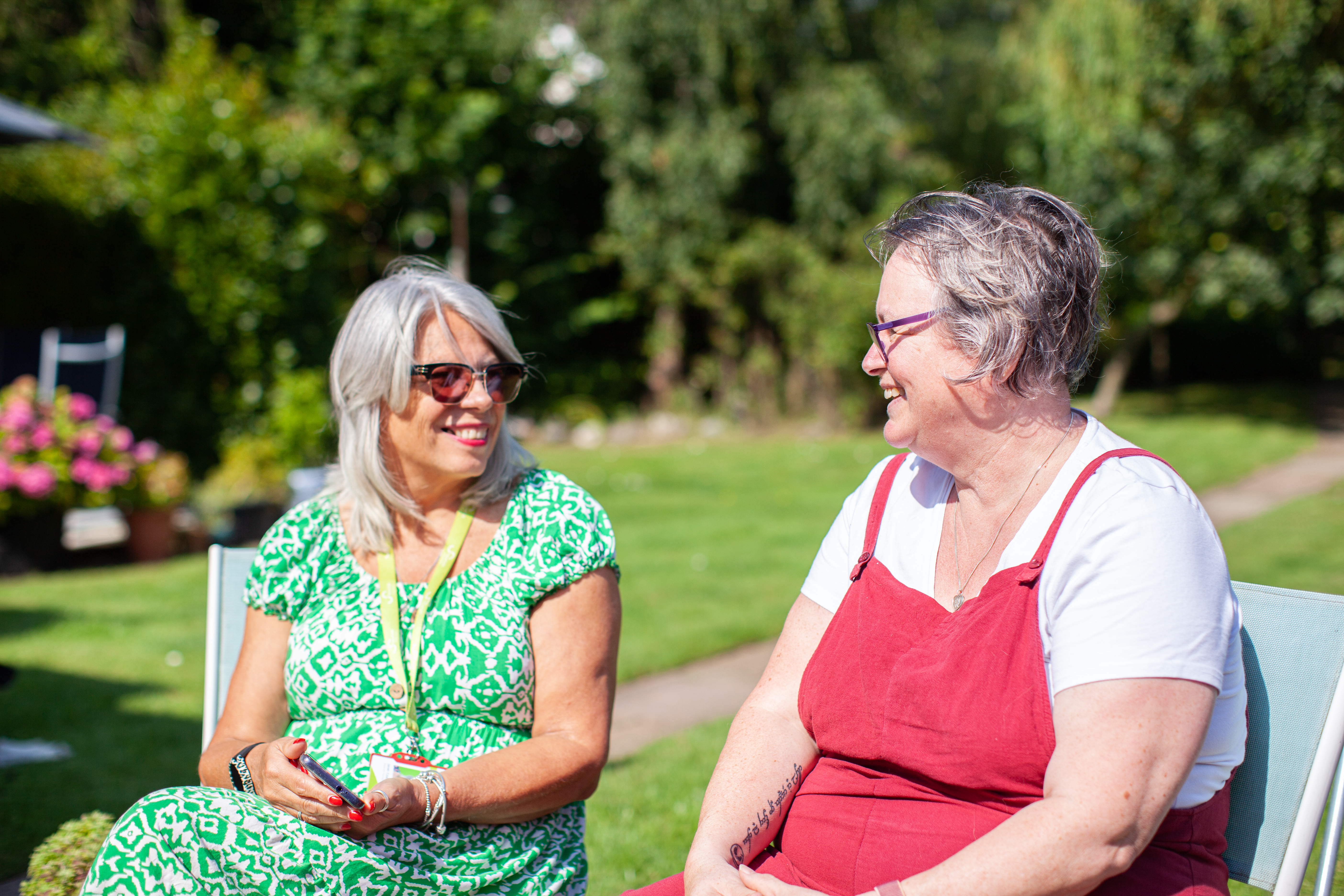 Two women sitting outside