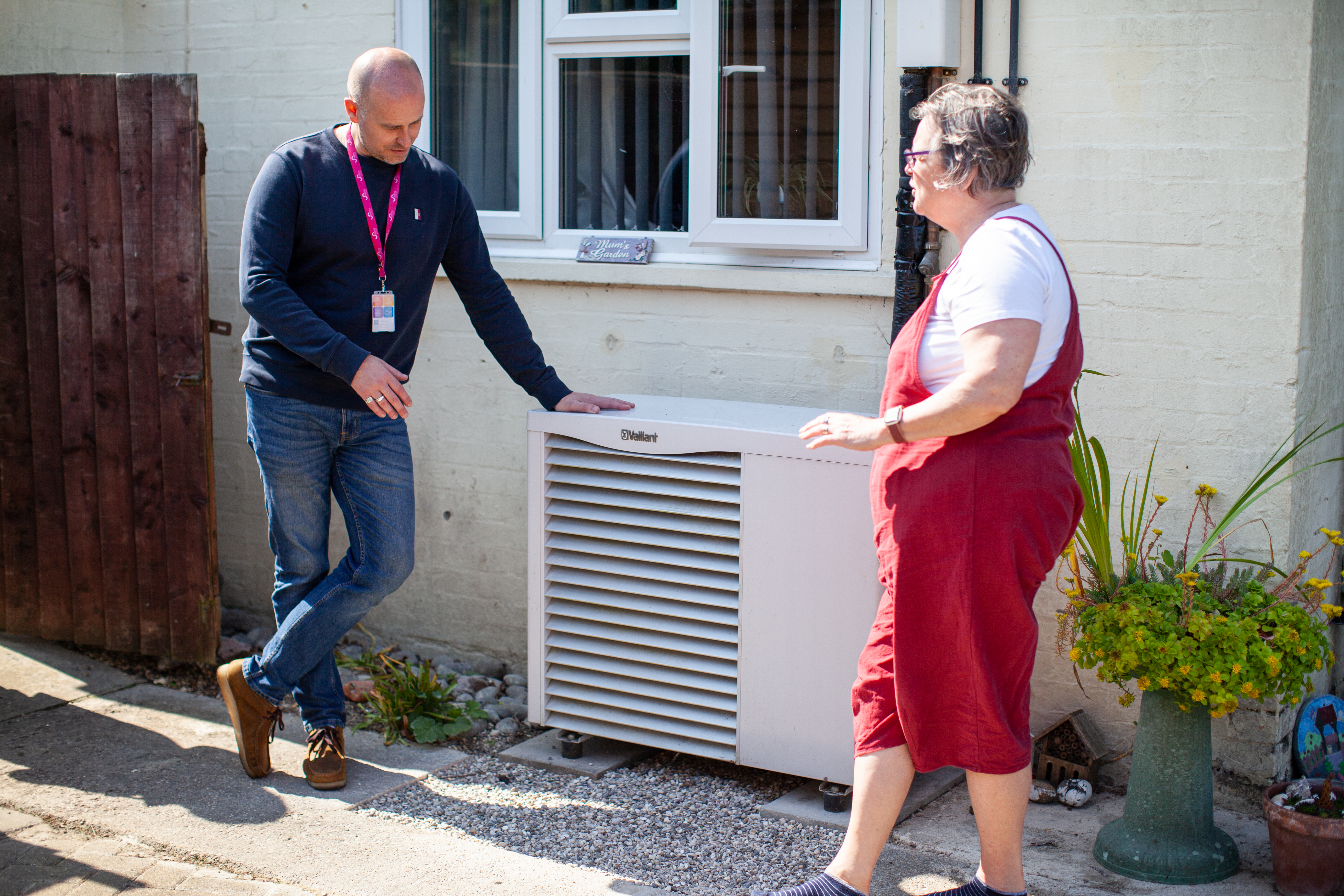 air source heat pump staff member and customer