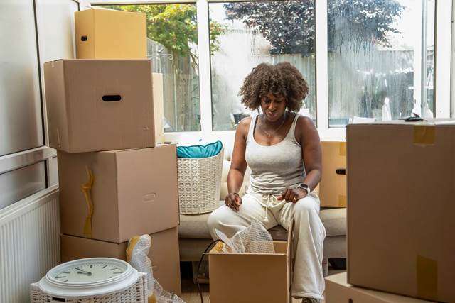 Person unpacking boxes